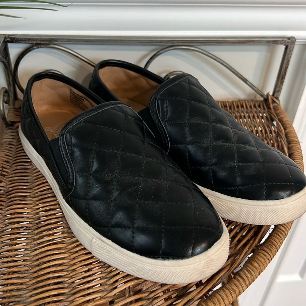 Black quilted slip on sneakers